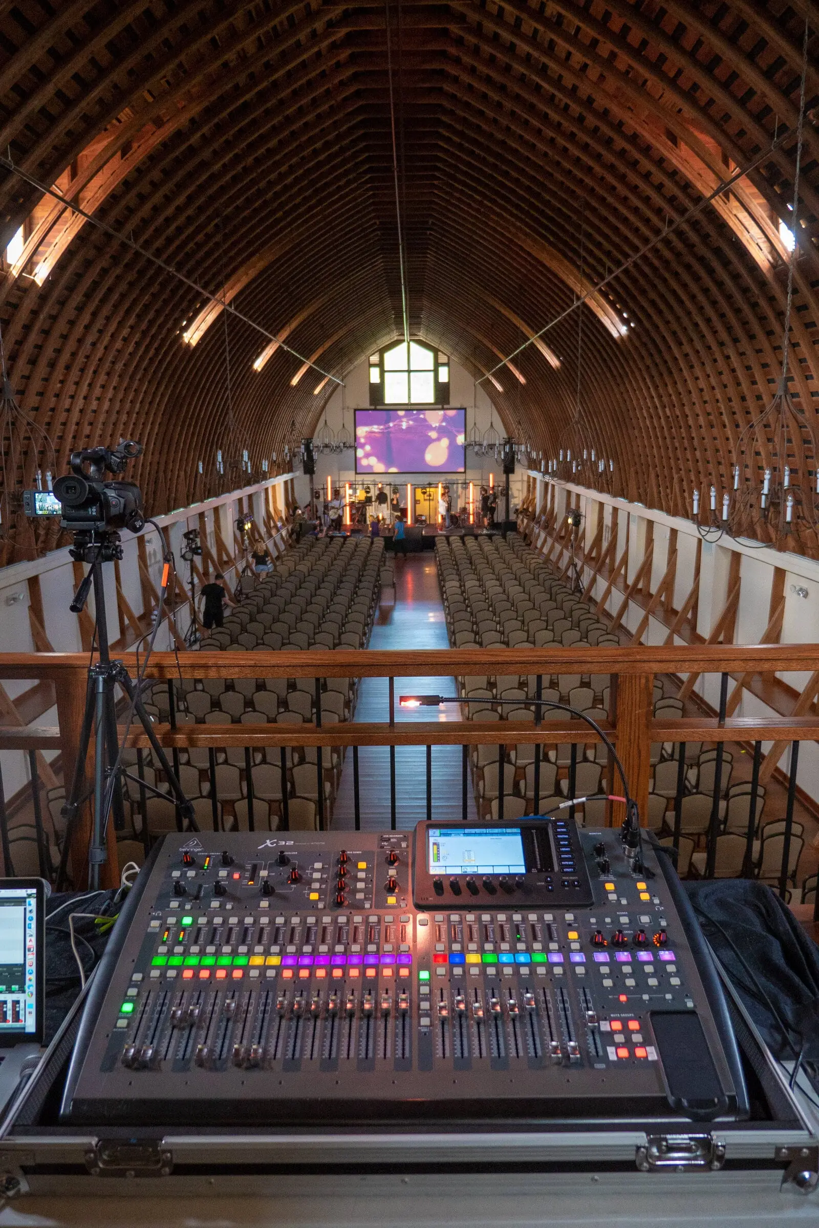 Conference set up in the Loft with an audio desk and a presentation on screen